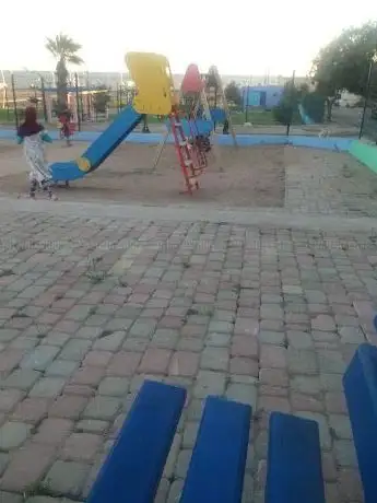 Photo de حديقة الألعاب للأطفال