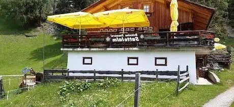 Photo de Sattelalm Hütte